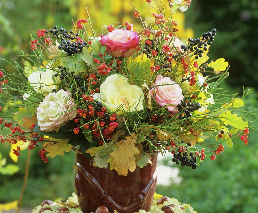 Arrangement Of Roses, Spindle Berries, Berries And Oak Leaves Photograph by Friedrich Strauss