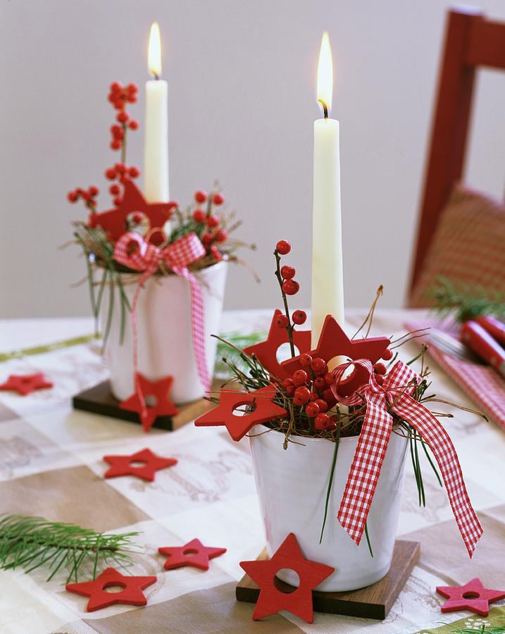 Arrangements Of Ilex Berries, Pine, Red Stars And Candles Photograph by Friedrich Strauss