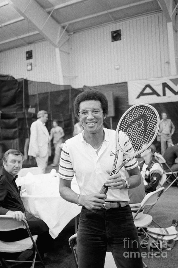 Arthur Ashe Posing With Tennis Racquet Photograph by Bettmann