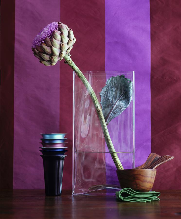 Artichoke Flower In Glass Vase Photograph by Matteo Manduzio
