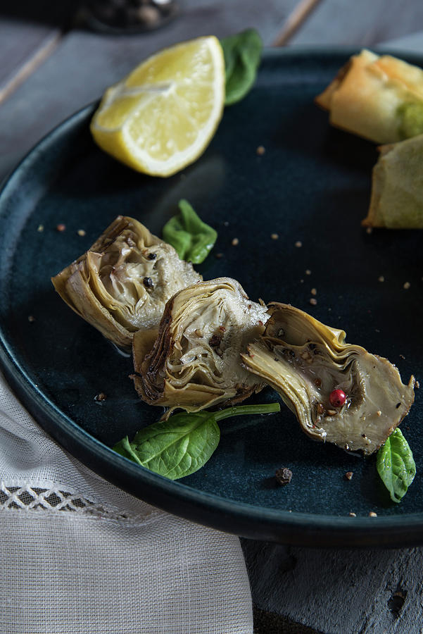 Artichoke Hearts With Pepper And Lemons Photograph by Myriam Meliani