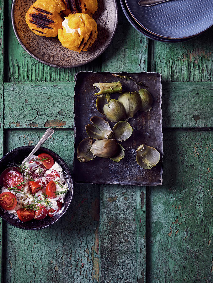 Artichoke Leaves, Tomato Salad With Dill And Cream Cheese, Breaded And Fried Cheese Balls Photograph by Angelika Grossmann