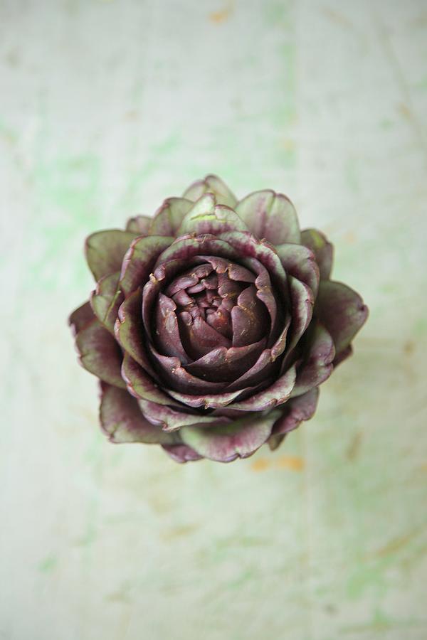 Artichokes On A Rustic Surface Photograph by Andre Baranowski