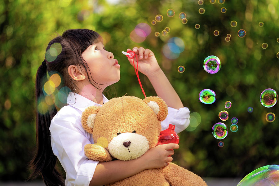Asian Girl Play A Bubble From Soap In Out Door Park Photograph By Anek