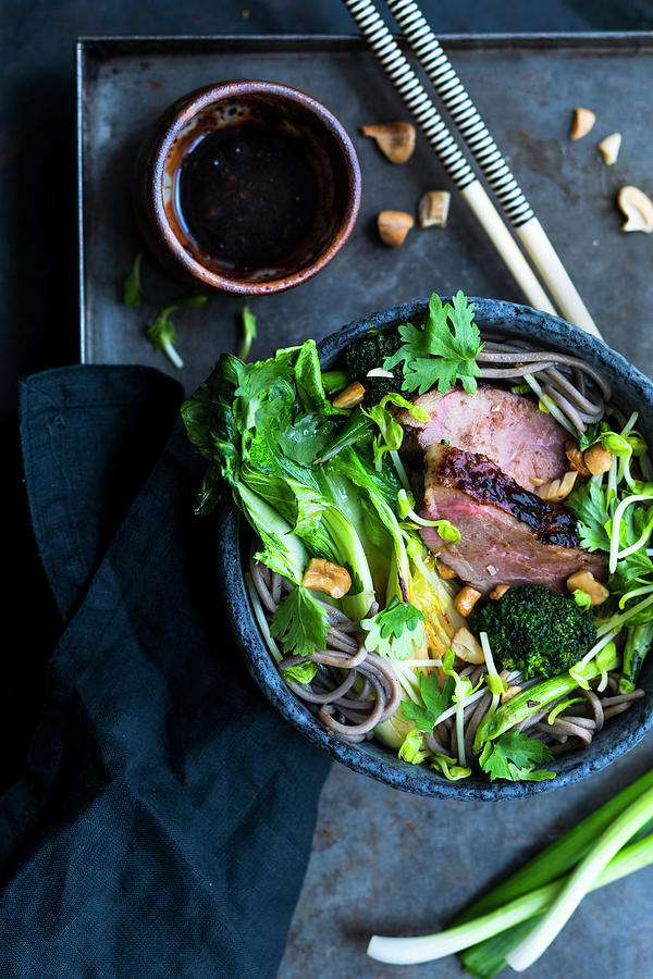 Asian Noodle Soup With Grilled Duck Breast And Pak Choi Photograph by Tina Engel