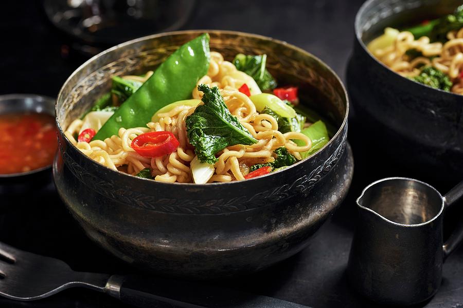 Asian Noodles With Kale, Sugar Snap Peas, Spring Onions, And Chili Peppers Photograph by Ulrike Emmert