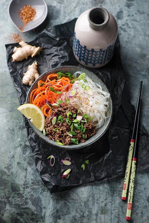 Asian Rice Noodles With Beef Chop And Carrot Salad Photograph by Ewgenija Schall