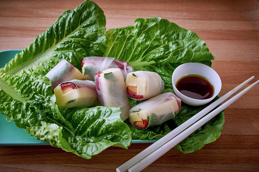 Duck Photograph - Asian Rice Paper Rolls With Duck, Cheese And Melon Served On Lettuce Leaves by Bernhard Winkelmann
