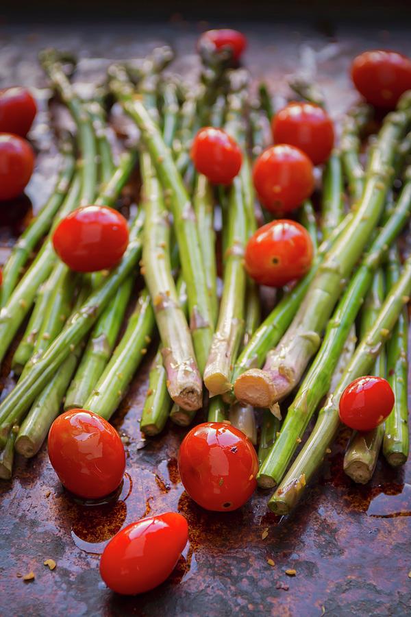 Asparagus And Organic Grape Tomatoes With Olive Oil And Spices On A Baking Tray Photograph by Brian Enright