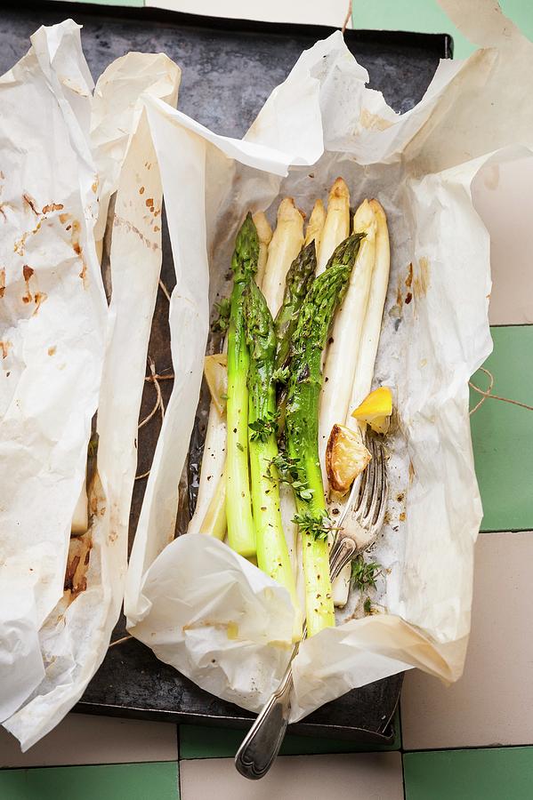 Asparagus In Parchment Paper Photograph by Manuela Rther