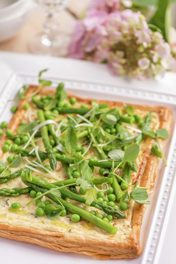 Asparagus Tart With Peas On A Garden Table Photograph by Winfried Heinze