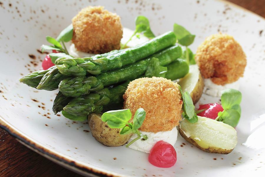 Asparagus With Fish Balls And Potatoes Photograph by Neil Langan