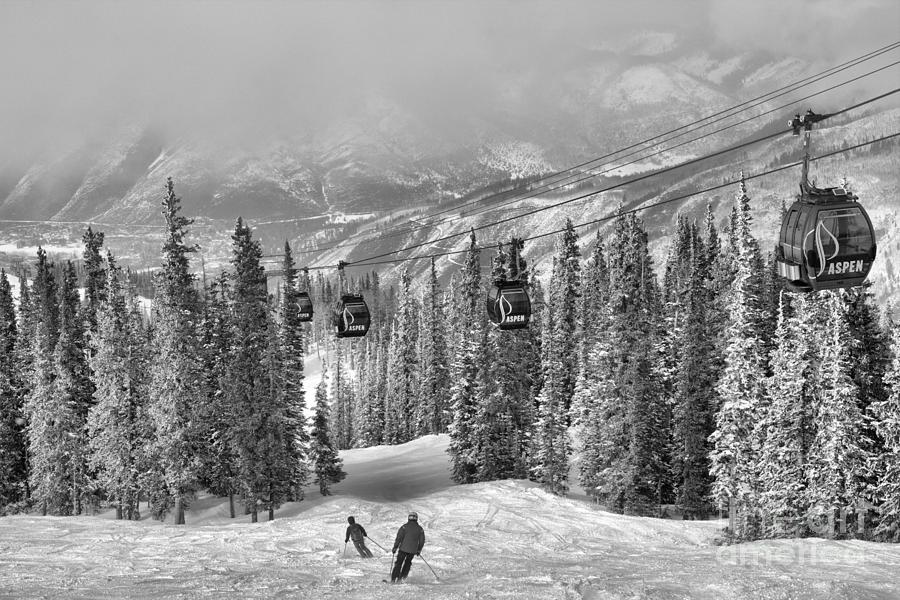 Aspen Skiers Under The Gondola Black And White Photograph by Adam Jewell