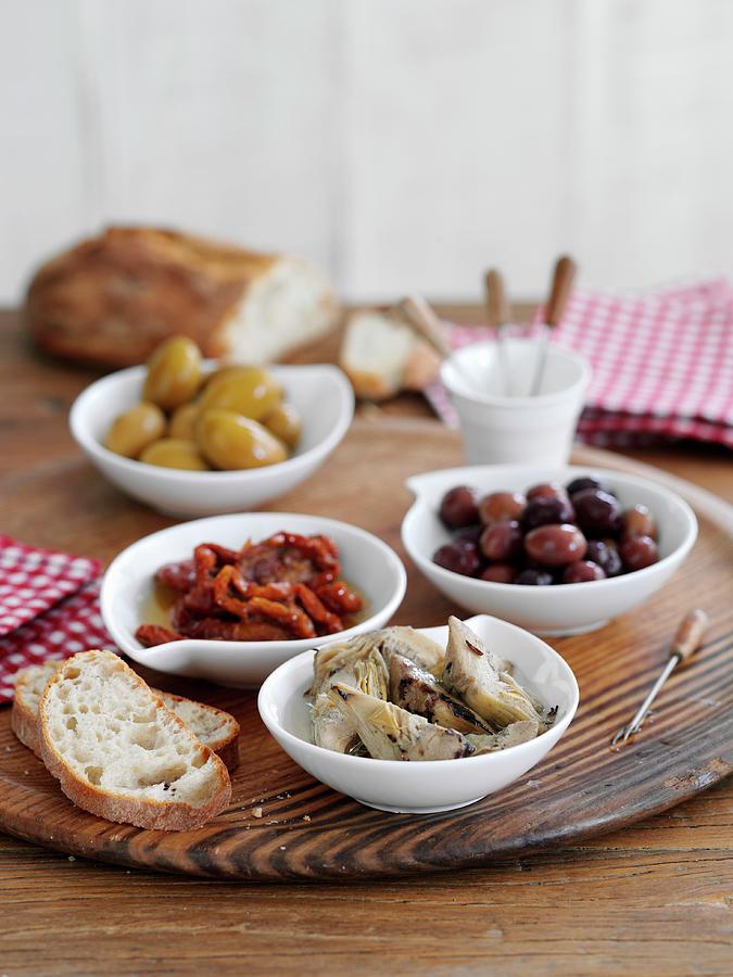 Assorted Antipasti And White Bread Photograph by Gareth Morgans