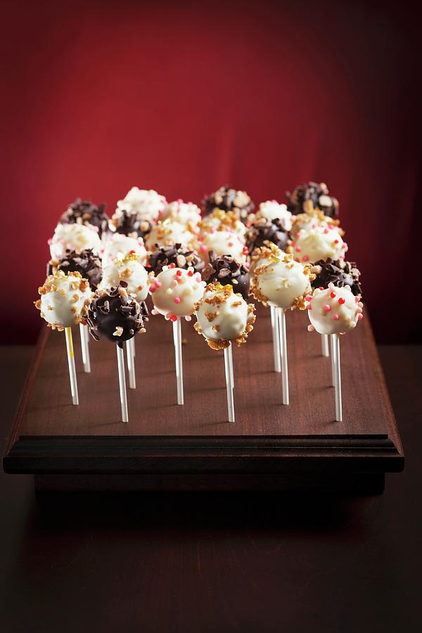 Candy Photograph - Assorted Cake Pops On A Wooden Stand by Tieuli, Anthony