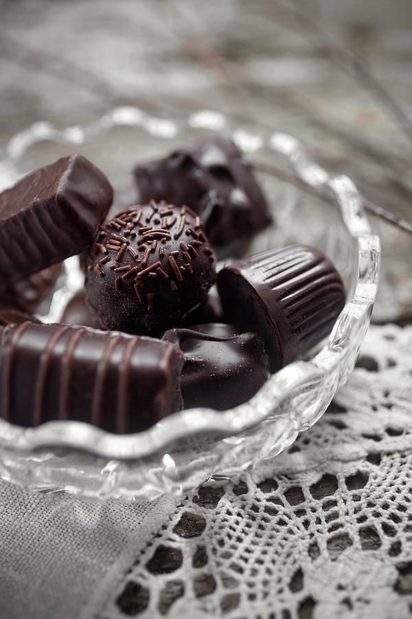 Assorted Filled Chocolates In A Glass Bowl Photograph by Stepien, Malgorzata