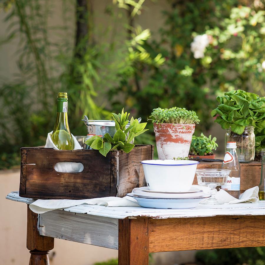 Assorted Herbs And Wine On A Wooden Table In The Garden Photograph by Great Stock!