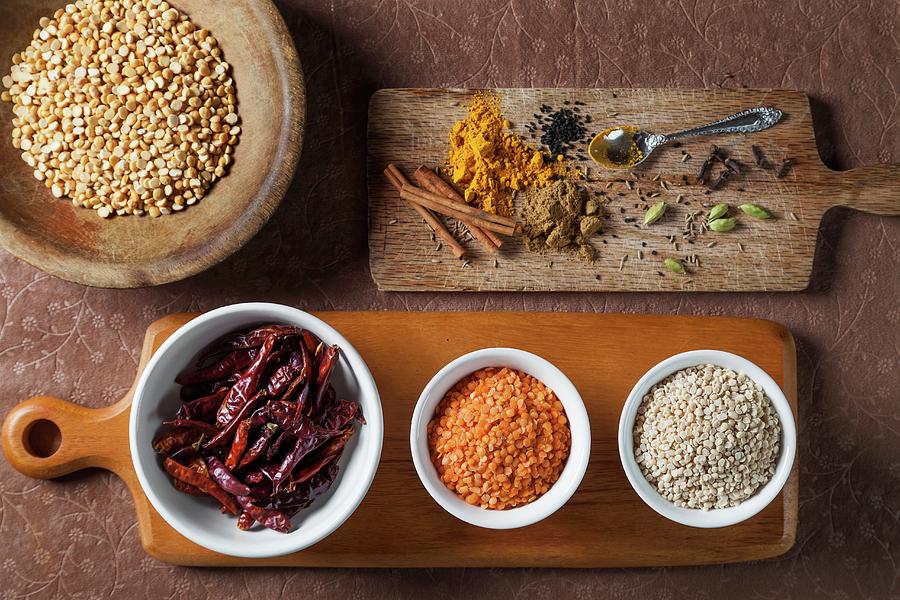 Assorted Ingredients For Indian Food. Lentils, Dried Chili Peppers, Cardamom, Turmeric, Cloves, Onion Seeds, Curry Powder, Cumin Seeds Photograph by George Crudo