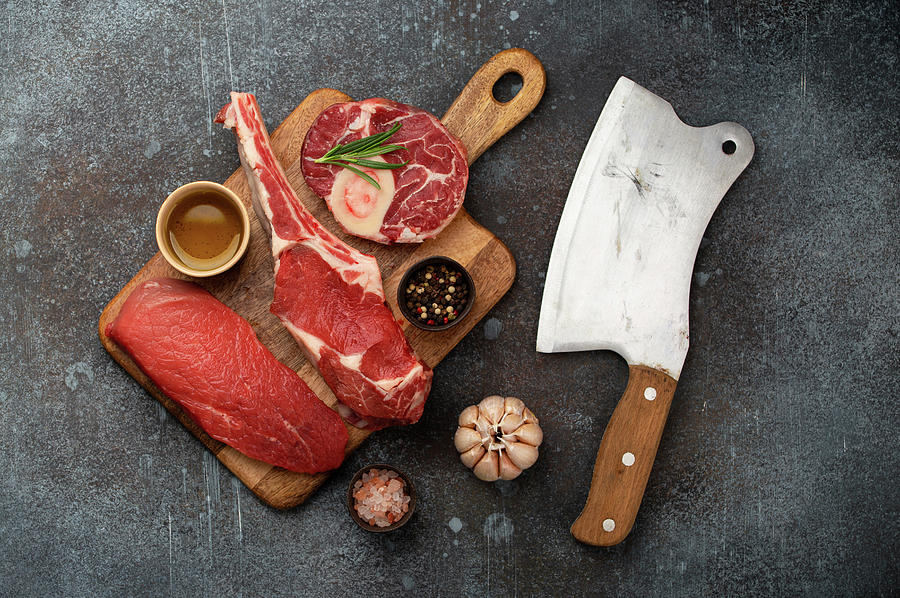 Assorted Meat Cuts And Different Steaks On Wooden Board, Rustic Meat Cleaver Photograph by Olena Yeromenko