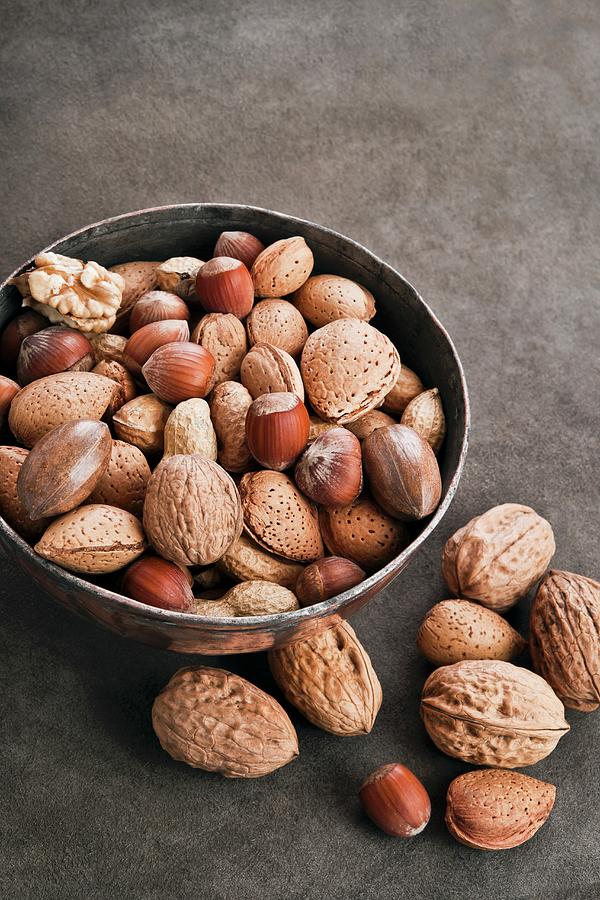 Assorted Nuts In A Metal Bowl Photograph by Atelier Hmmerle