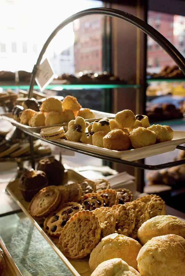 Assorted Pastries On Display In A Cafe Photograph by David Mcglynn
