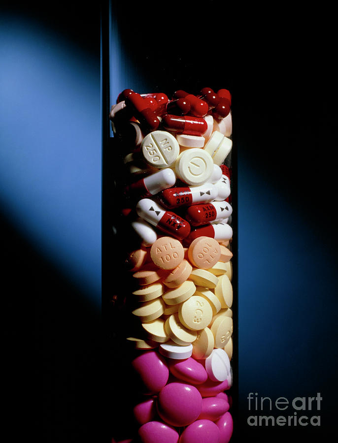 Assorted Pills And Drug Capsules In Glass Cylinder Photograph by Colin Cuthbert/science Photo Library