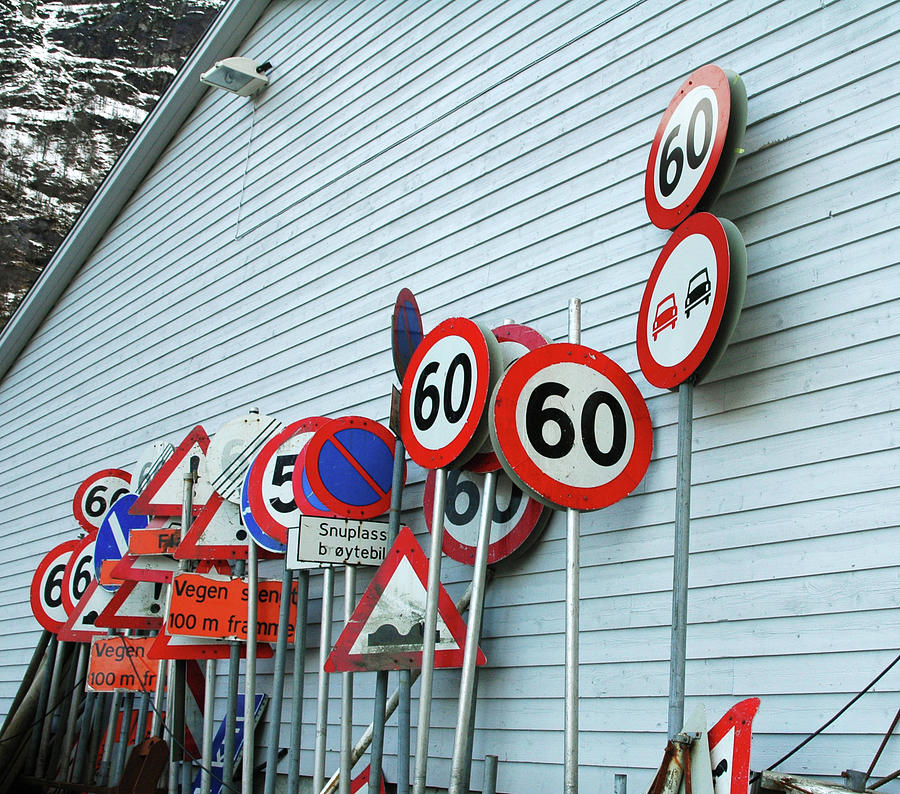 Assorted Road Signs Stacked Against Photograph by Kjerstin Gjengedal