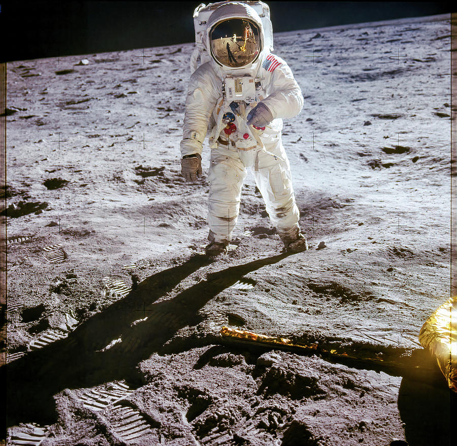 Astronaut Edwin Aldrin walks on lunar surface near leg of Lunar Module Photograph by Eric Glaser