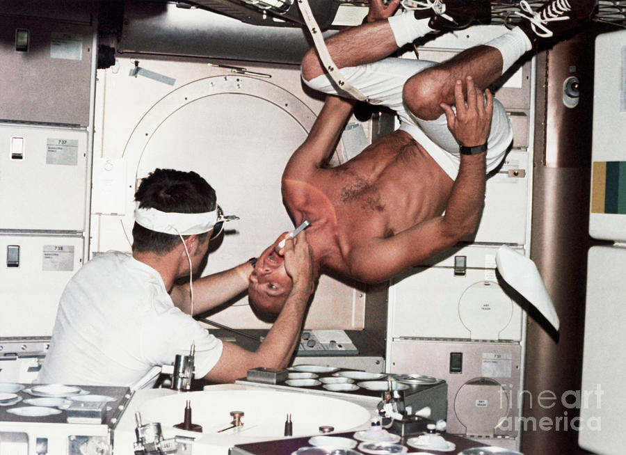 Astronaut Gets Upside-down Oral Exam Photograph by Bettmann