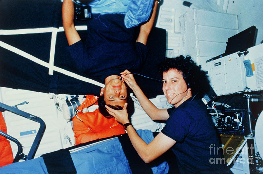 Astronaut Performing Medical Check-ups On Crew. Photograph by Nasa/science Photo Library