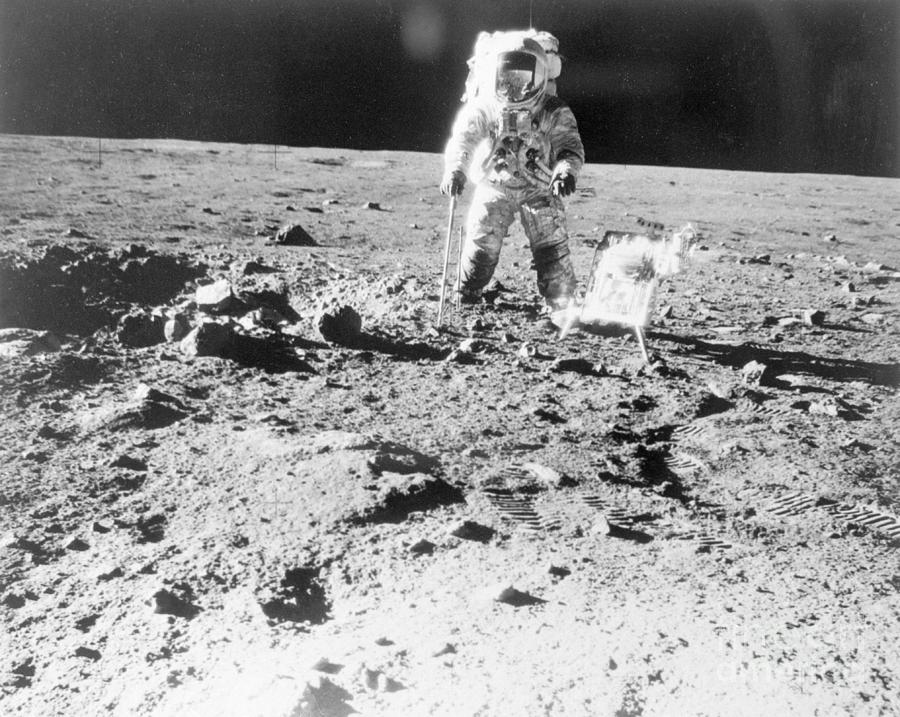 Astronaut Walking On Moon During Apollo Photograph by Bettmann