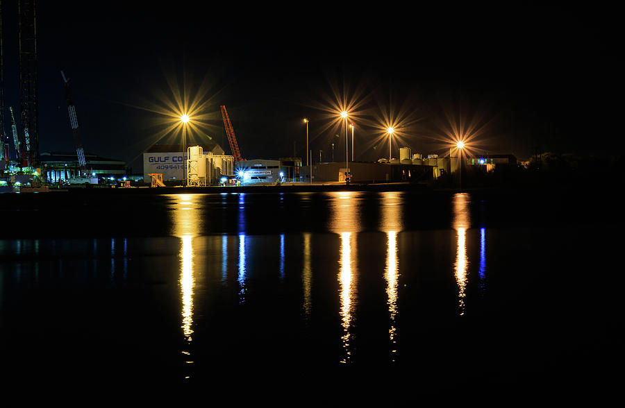 Sunset Photograph - At night looking across the Galveston Channel at Gulf Cooper Dry Dock by David Ilzhoefer