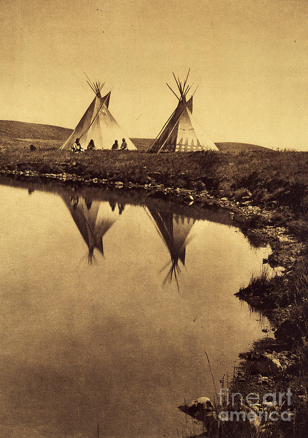 At The Water Edge: Camp Piegan At The Edge Of A Water Body. Photo Taken From Volume 6 Of The Encyclopedia Published By Edward S. Curtis Photograph by Edward Sheriff Curtis