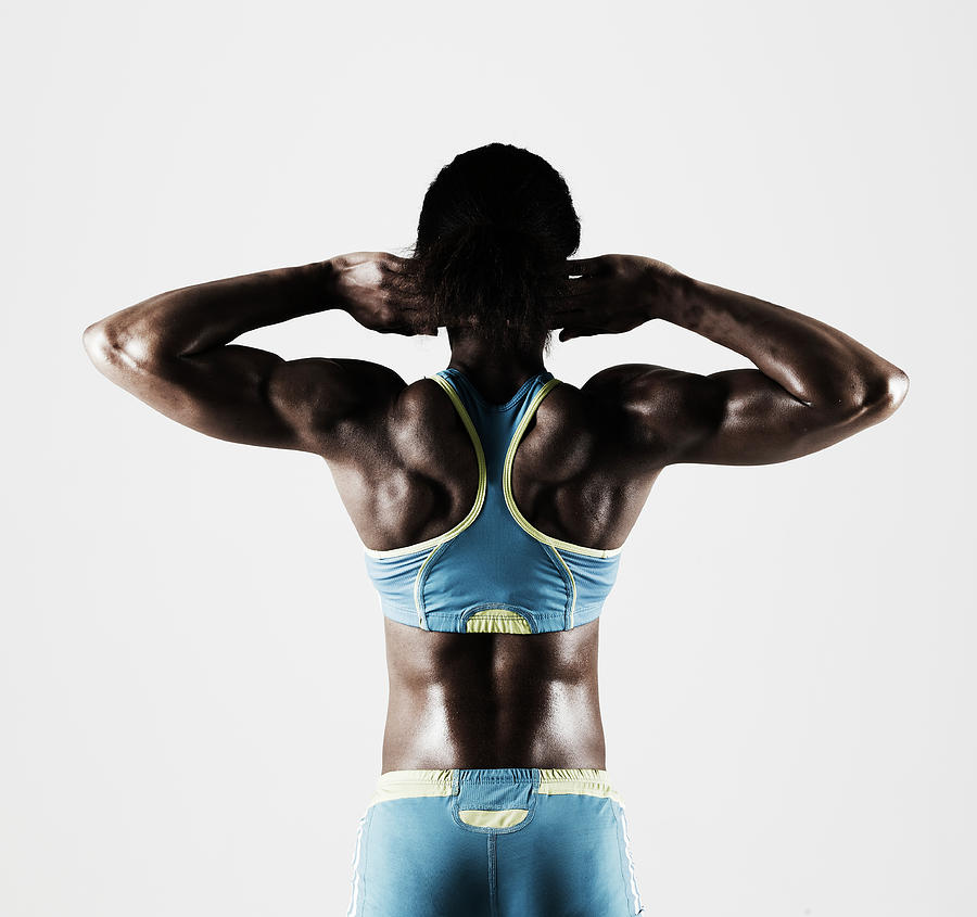 Athletic Black Female Tensing Back Photograph by Mike Harrington