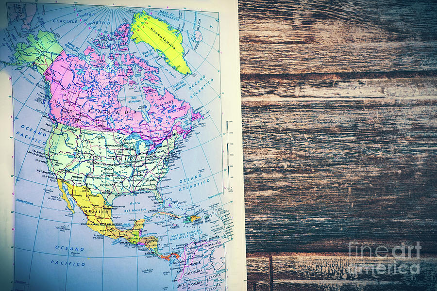 atlas page North America continent retro map with wooden vintage background Photograph by Luca Lorenzelli