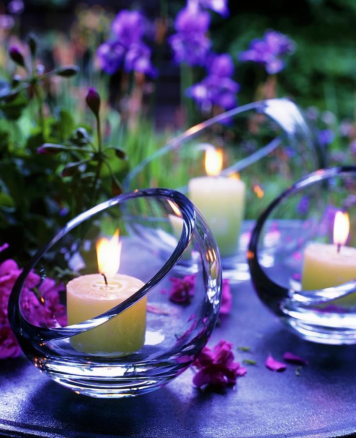 Atmospheric Table Decorations: Lit Candles In Glass Bowls With Angled Openings At Twilight Photograph by Matteo Manduzio