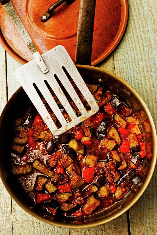 Aubergine And Tomato Sauce In A Pan Photograph by Roger Stowell