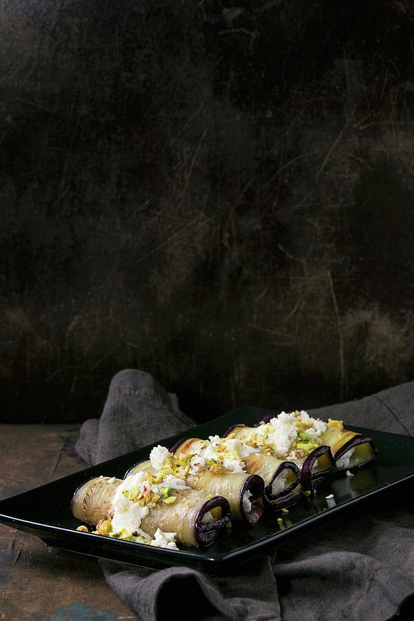 Aubergine Rolls With Ricotta, Garlic, Cheese Sauce And Pistachio Nuts Photograph by Natasha Breen