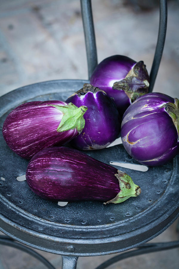 Aubergines On A Vintage Chair Photograph by Eising Studio