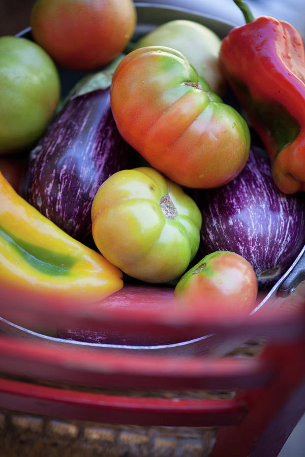 Aubergines, Tomatoes And Pepper In A Metal Basket Photograph by Eising Studio