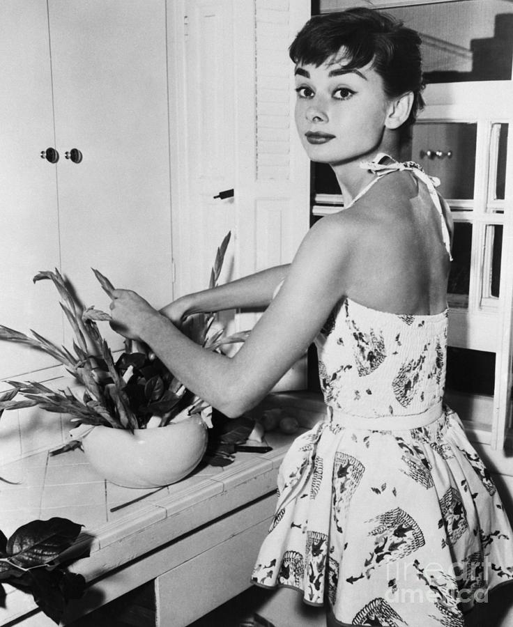 Audrey Hepburn Arranging Flowers Photograph by Bettmann