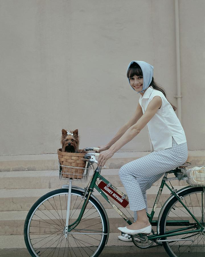 Audrey Hepburn Riding A Bicycle Photograph by Cecil Beaton