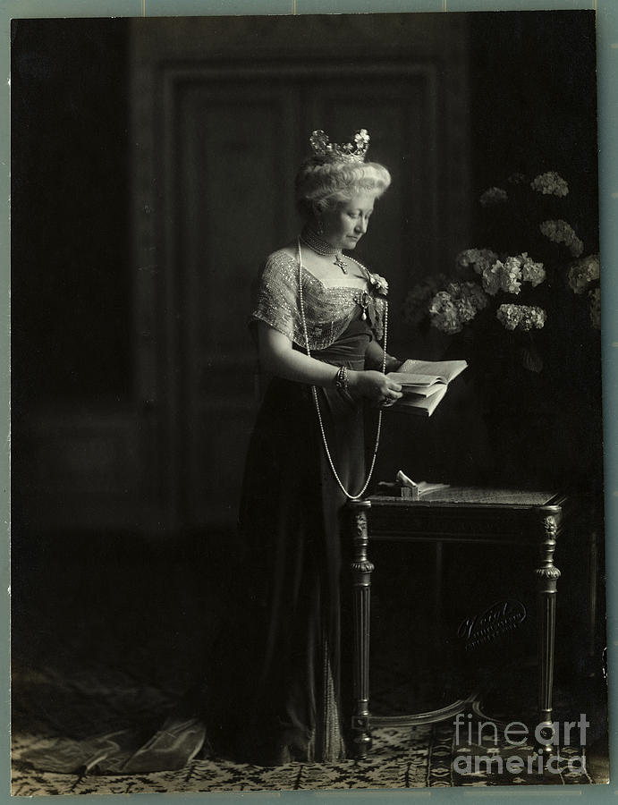 Augusta Victorio Reading Book Photograph by Bettmann
