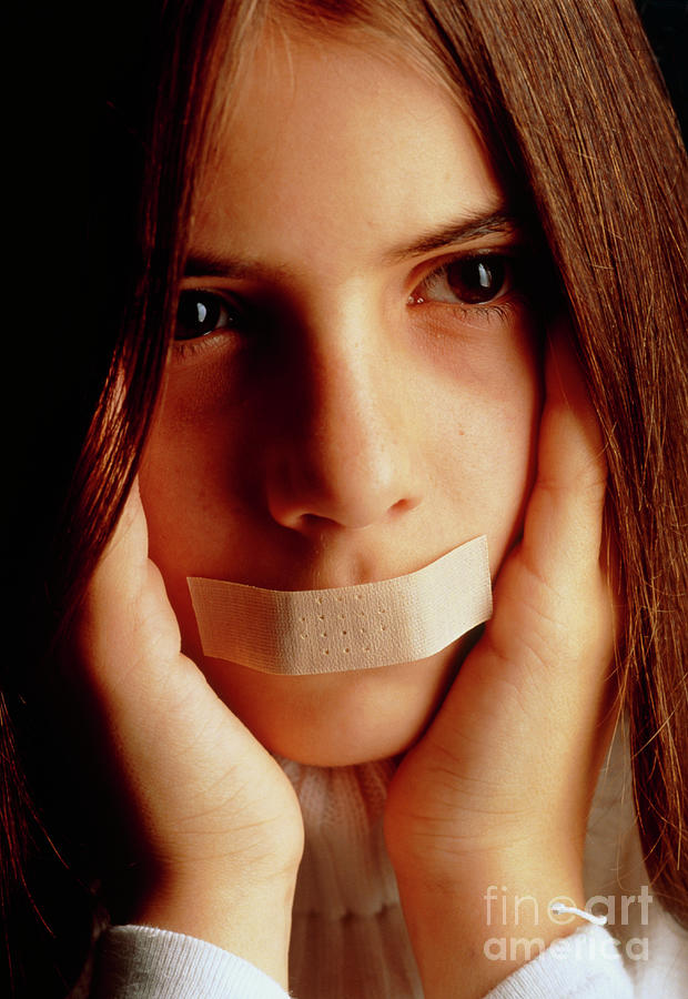 Autism Girl With Tape Over Mouth & Covering Ears Photograph by Oscar
