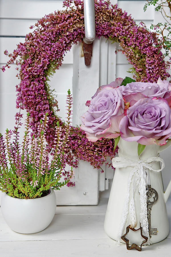 Autumn Arrangement With Heather Wreath, Vase Of Roses And Potted Ling Photograph by Angelica Linnhoff
