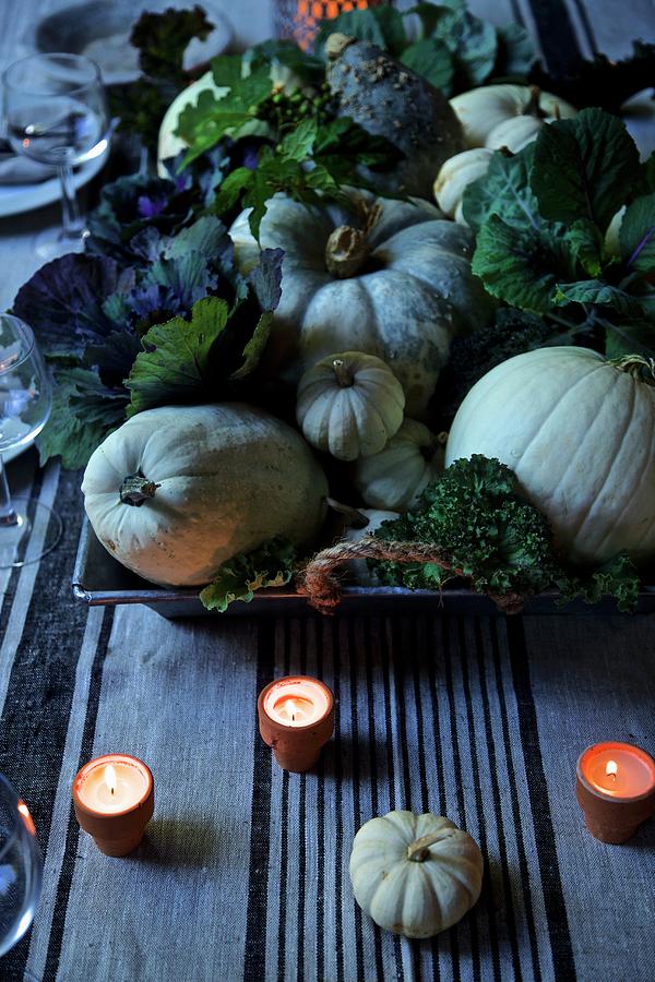 Autumn Centrepiece With Pumpkins, Cabbages And Candles Photograph by Andre Baranowski