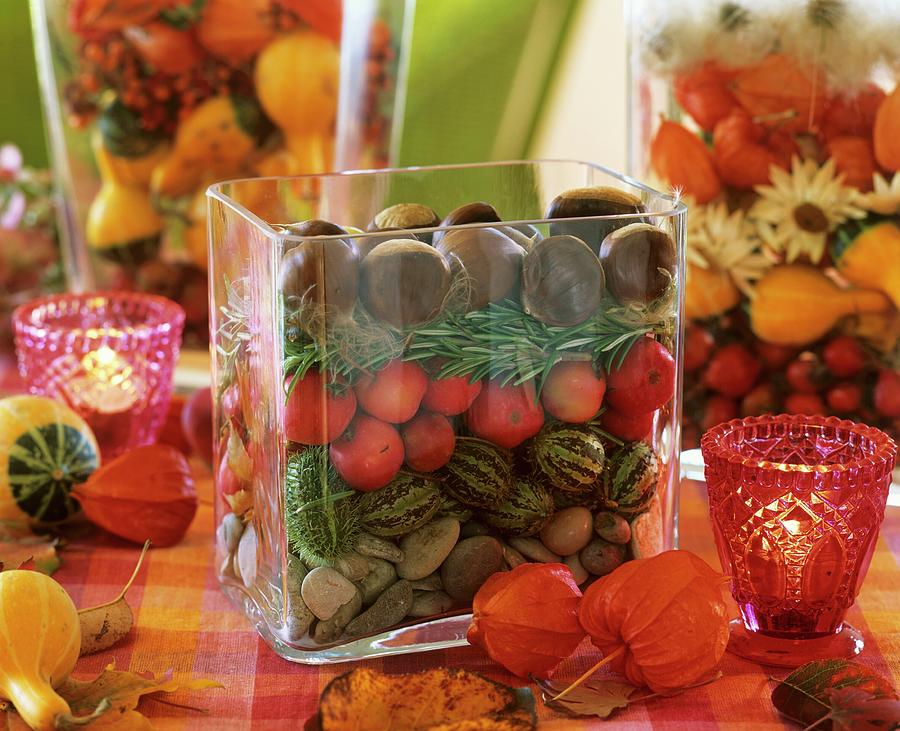 Autumn Decorations In Glass Containers Photograph by Friedrich Strauss