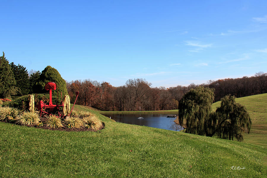 Autumn in Frederick Maryland - Red Farm Tool overlooking the Pond Photograph by Ronald Reid