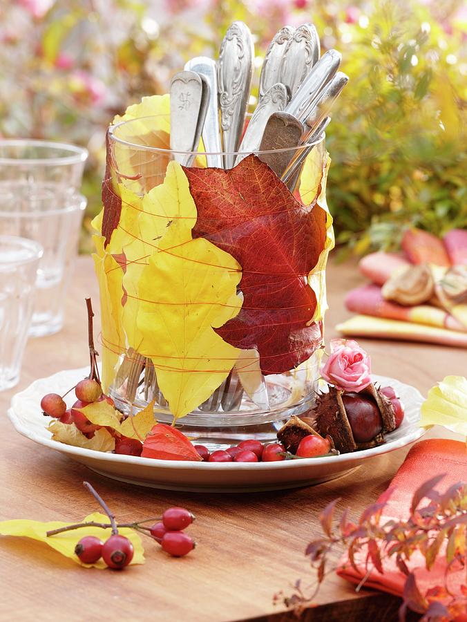 Autumn Leaves And Cutlery In Glass table Decoration Photograph by Strauss, Friedrich