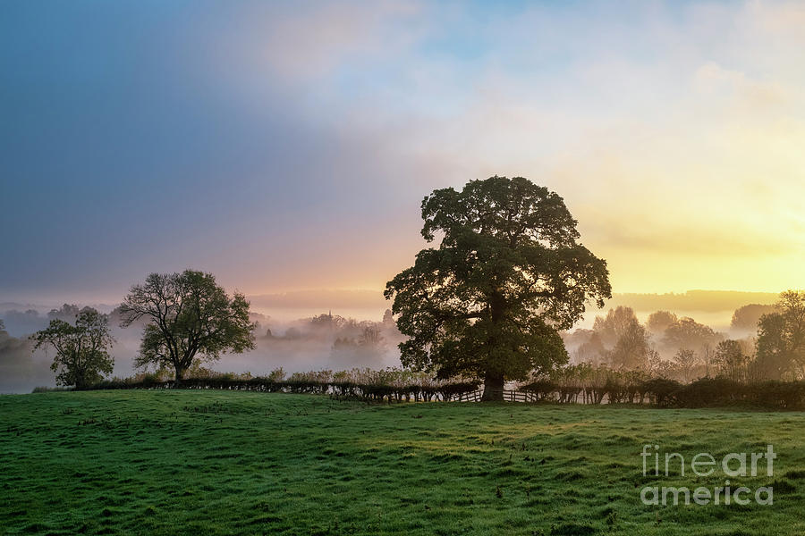 Autumn Mist and Fog Over Lower Slaughter Village Photograph by Tim Gainey